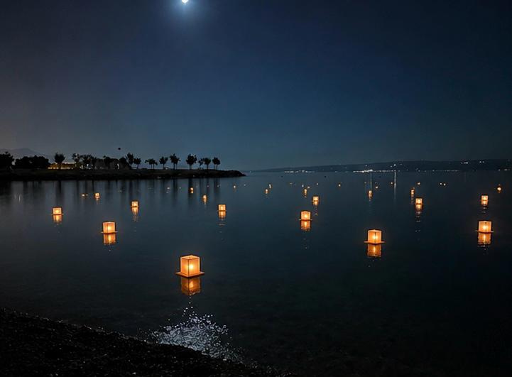 Lanterns floating on the sea at night