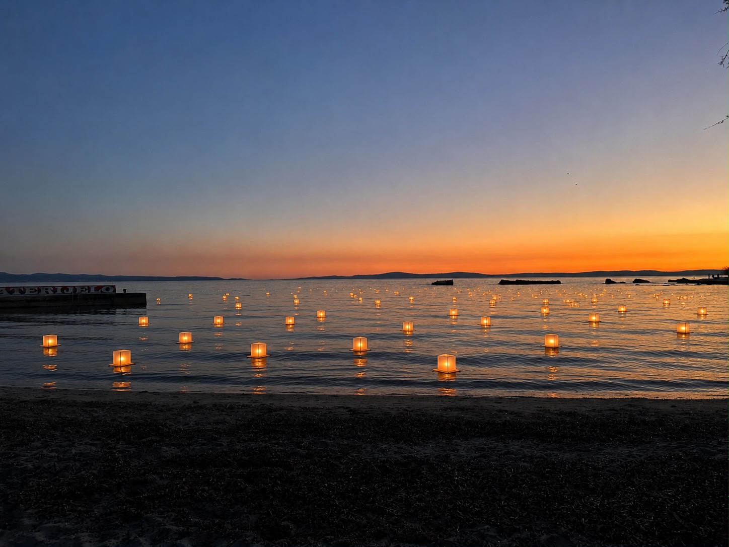 Lanterns on water at golden sunset